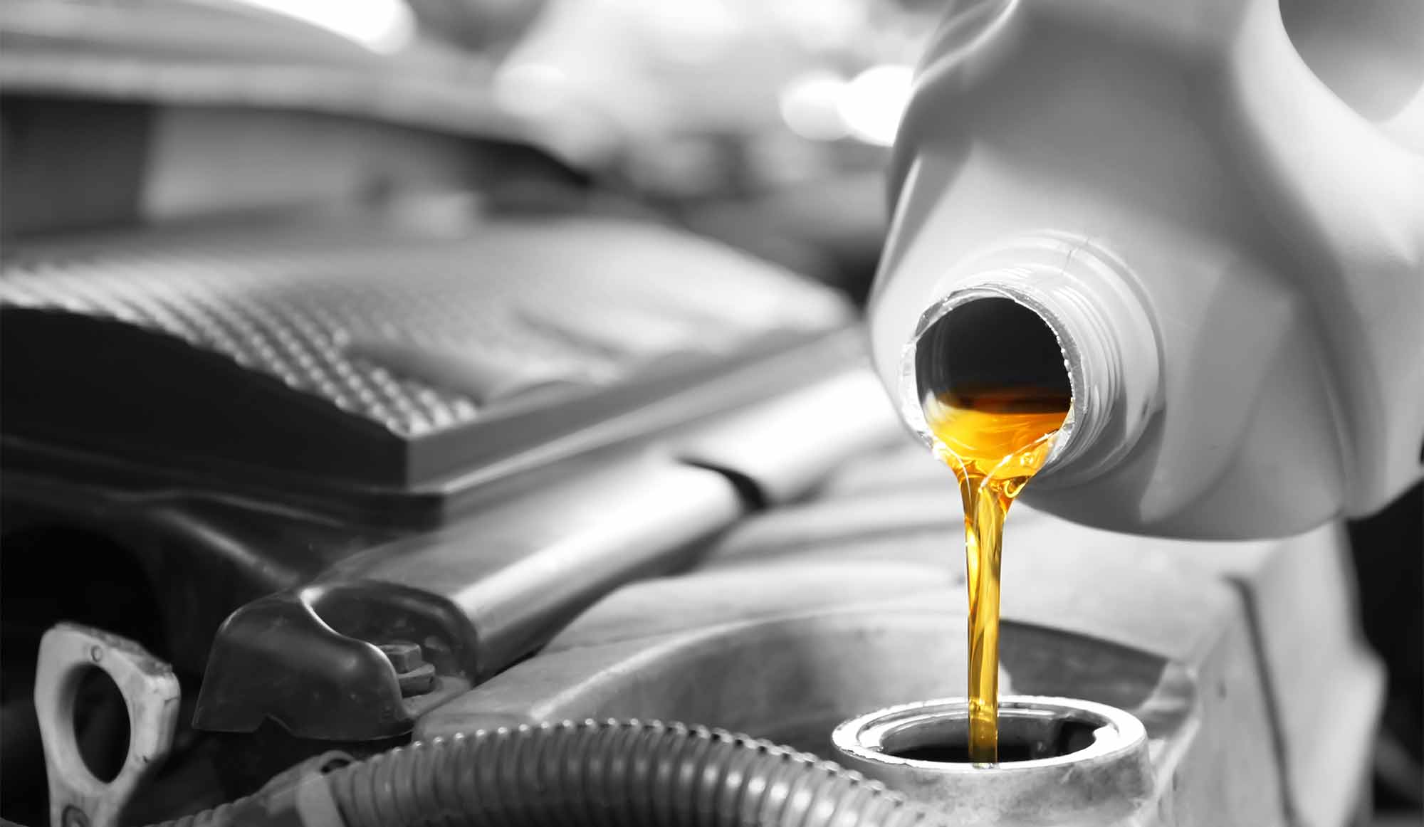 Oil change factory scheduled maintenance oil change in process