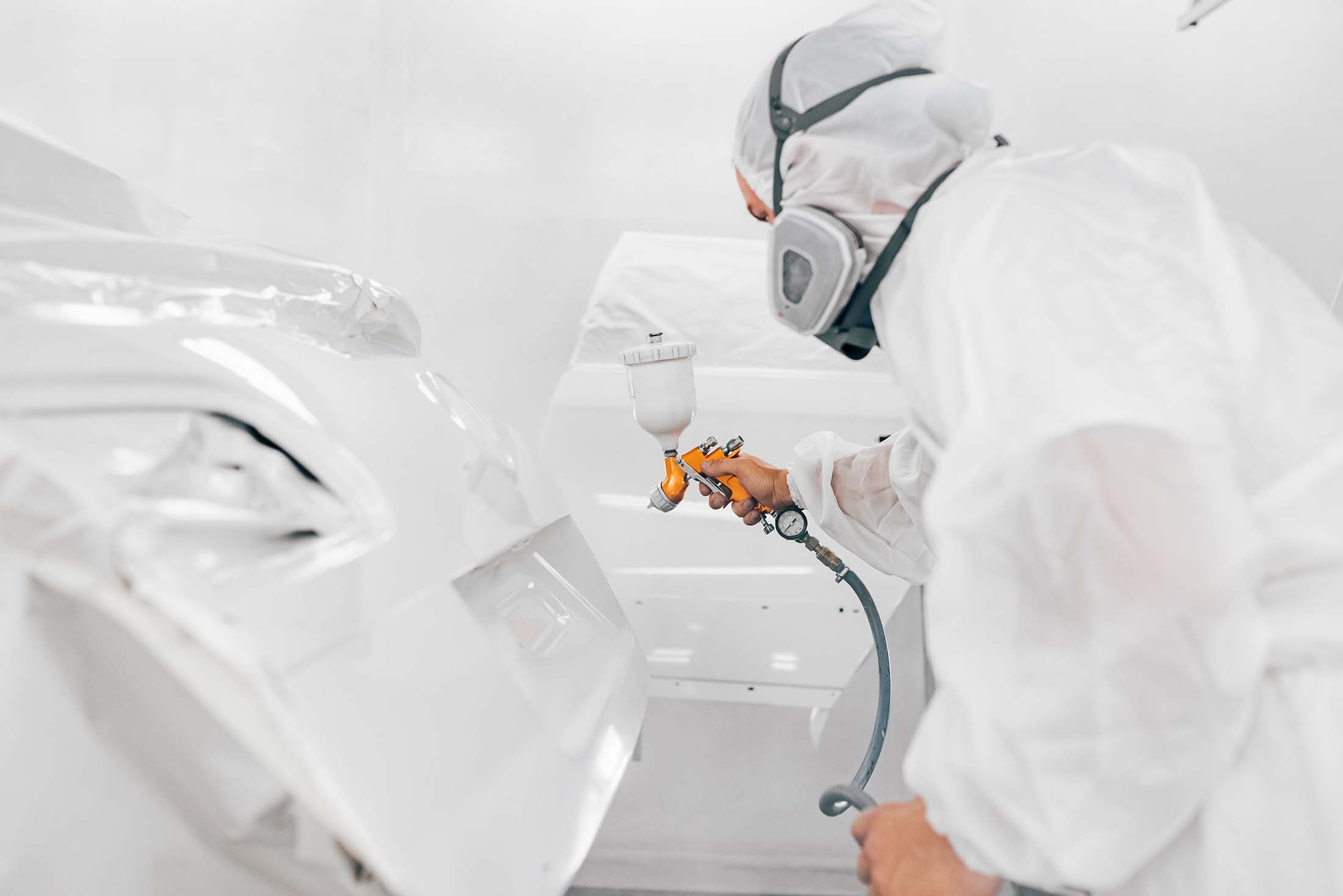 Auto Paint Repair – Painter Spraying Decklid Auto Paint Repair - Painter Spraying Decklid